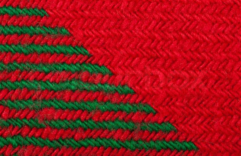 Handmade knit green and red background. Close up structure of the yarn. Christmas colors, stock photo