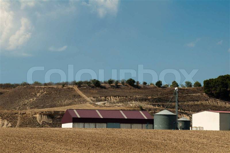 Warehouse and feed mill in a farm, stock photo