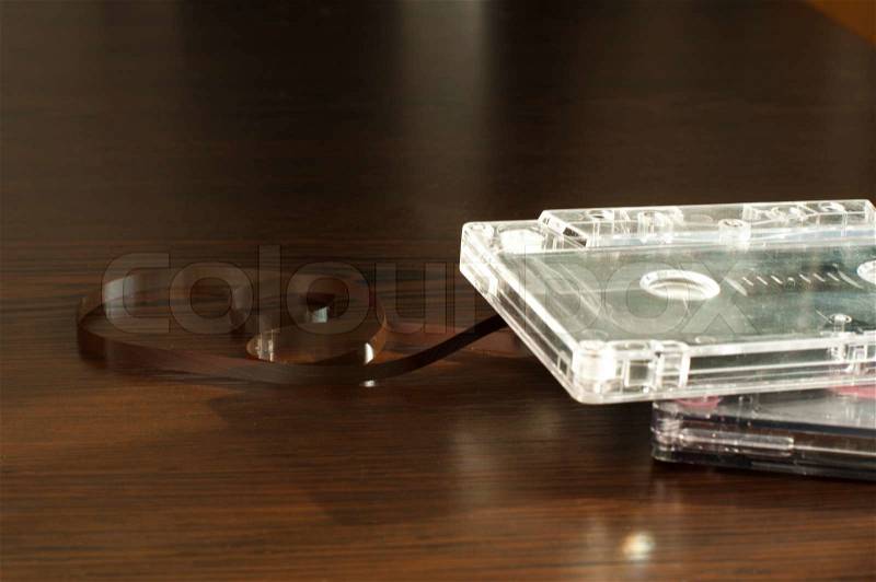 Audio tape cassettes with subtracted out tape. Old broken cassette, stock photo