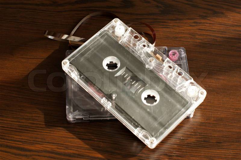 Audio tape cassettes with subtracted out tape. Old broken cassette, stock photo