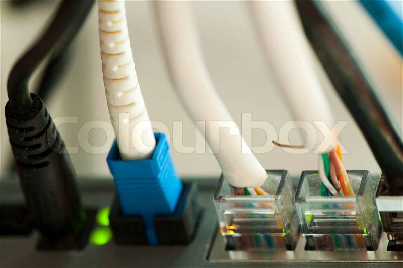 Jacks of the LAN cable plugged in the router. Very close uo, stock photo