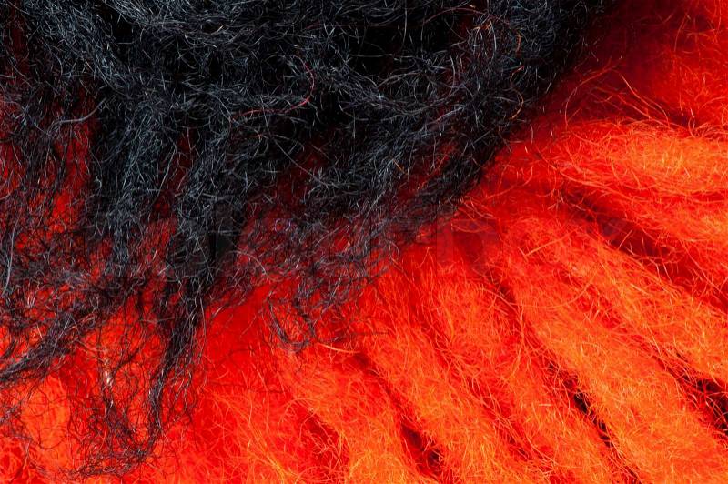 Black and red wool fibers closeup, stock photo