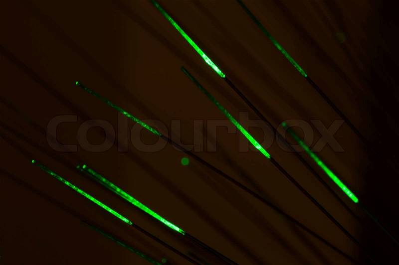 Optical fibers of fiber optic cable. Internet technology. Green color, stock photo