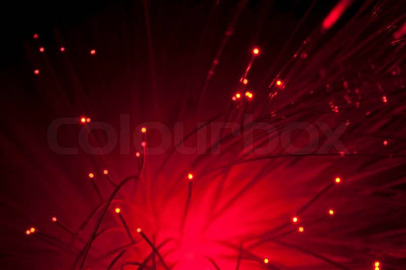 Optical fibers of fiber optic cable. Internet technology.Red color, stock photo