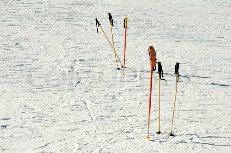 Ski poles stuck in the snow, stock photo