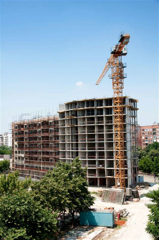 Construction industry and cran. Vertical image, stock photo