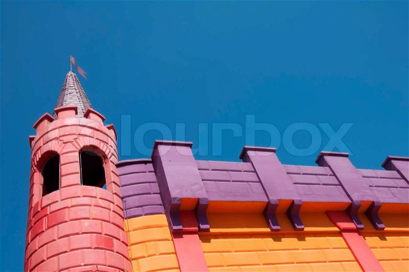 Wall of fairy-tale castle.Towers of the castle, stock photo