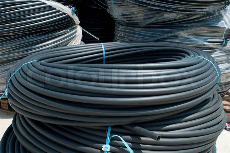 Coiled black PVC hoses. Polyethylene tubing, stock photo