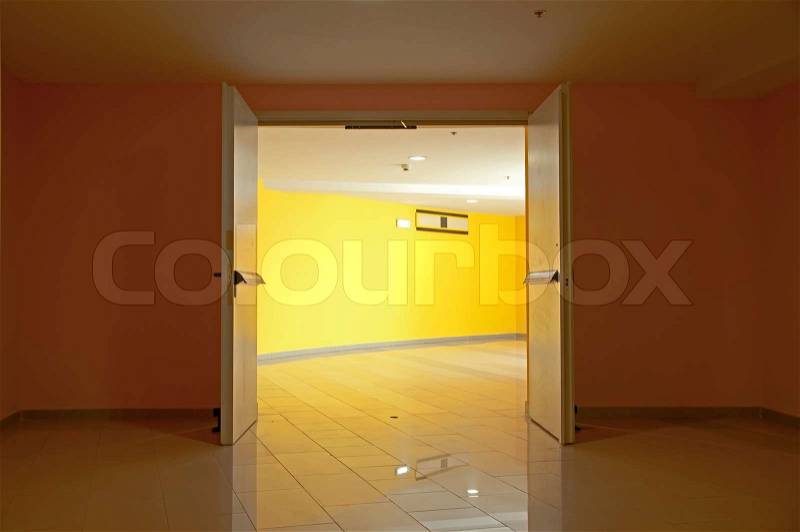 Two opened doors and yellow walls, stock photo