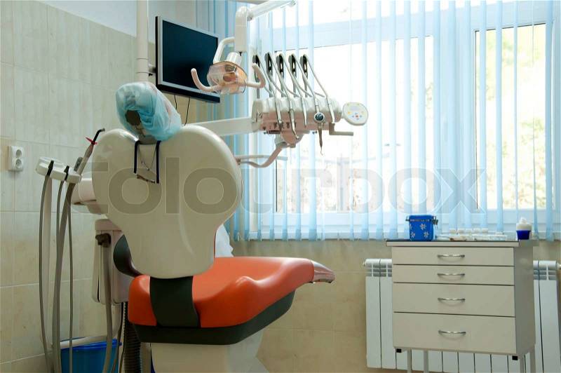 Dental surgery equipment. Chair and lighting, stock photo