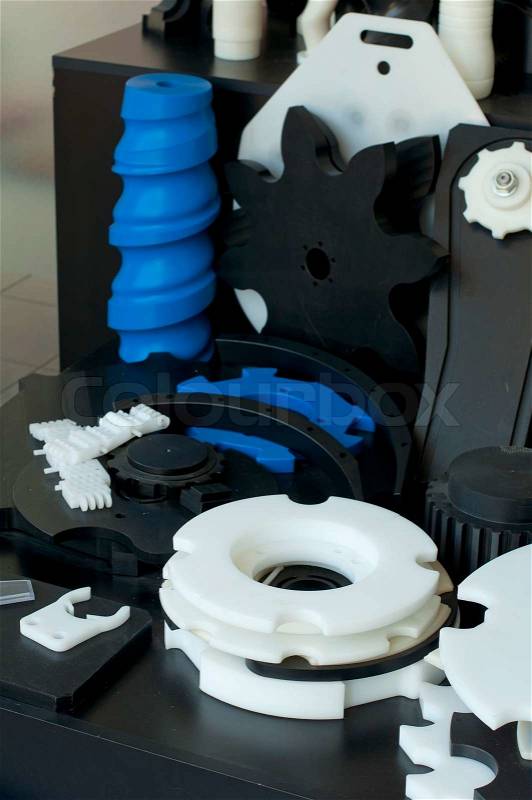 Plastic machine parts. Vertical imagel, stock photo