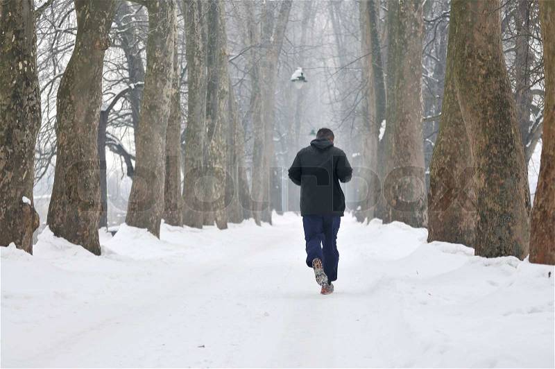 One older man running at alley on winter seasson at early morning, stock photo
