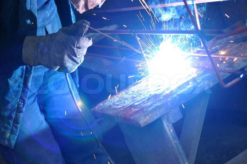 Weld machine worker hard industry business, stock photo