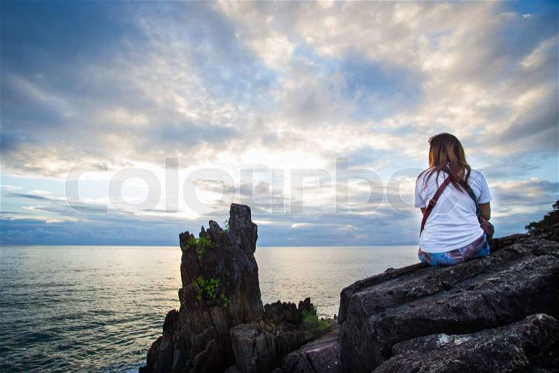 People sitting silhouette by the sea, stock photo