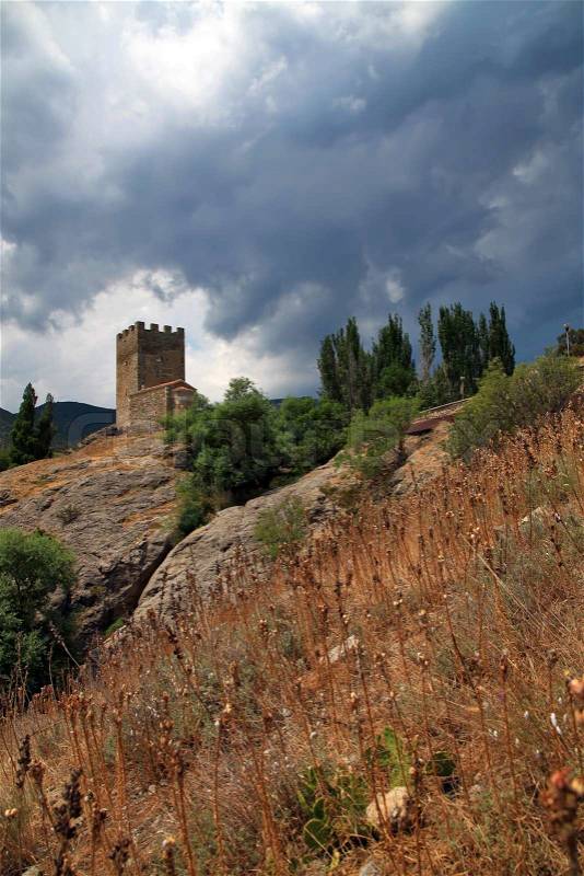 Castle on the cliff with stormy sky, stock photo