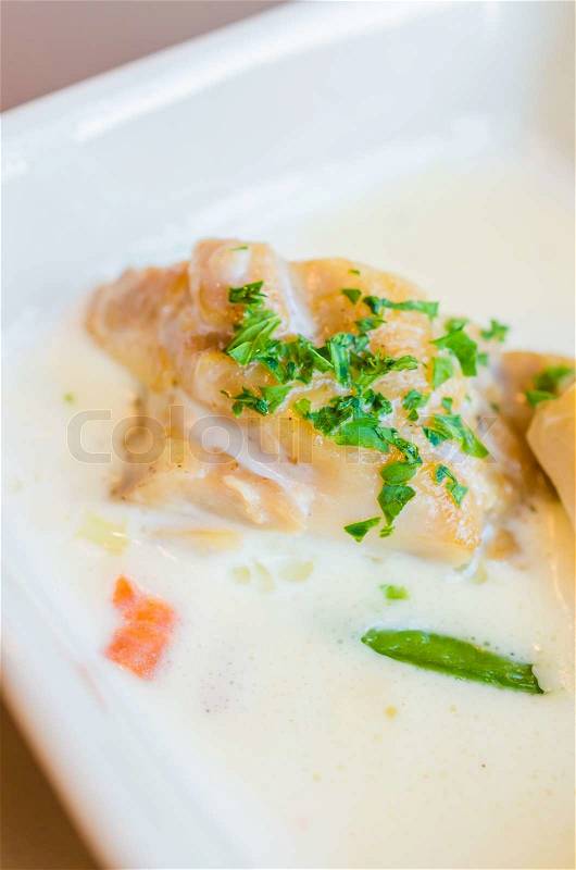Fish with white sauce and mushroom, stock photo