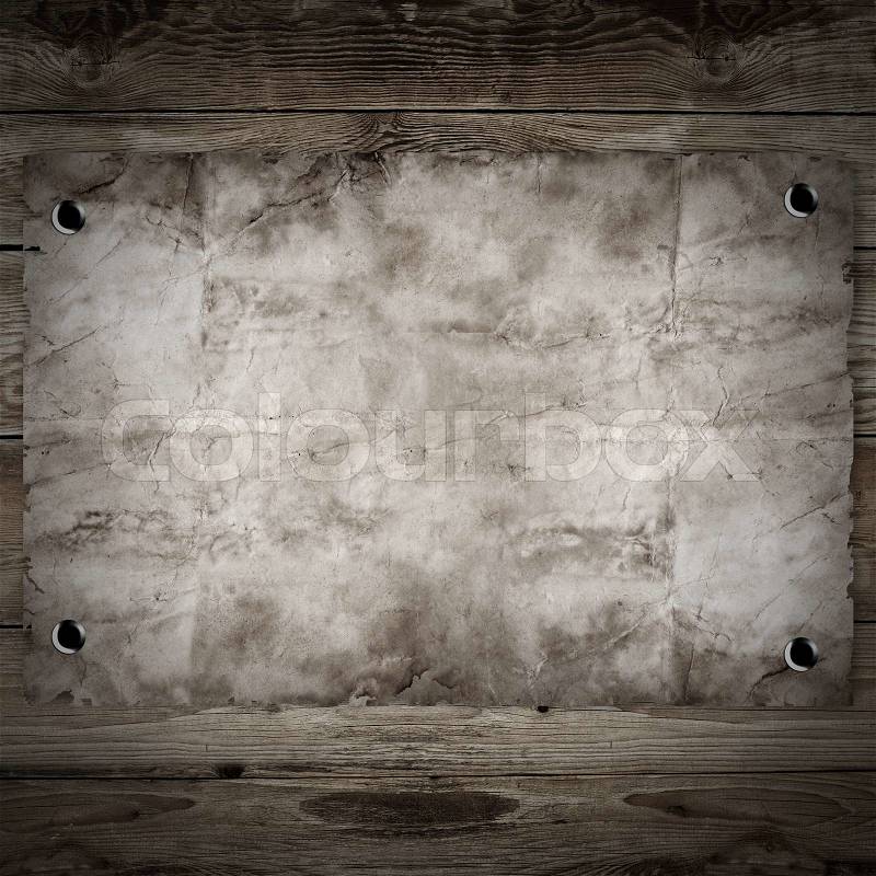 Old western wanted poster on wooden background, stock photo