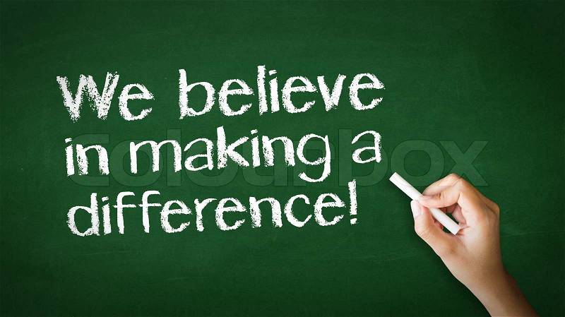 A person drawing and pointing at a We believe in making a difference Chalk Illustration, stock photo