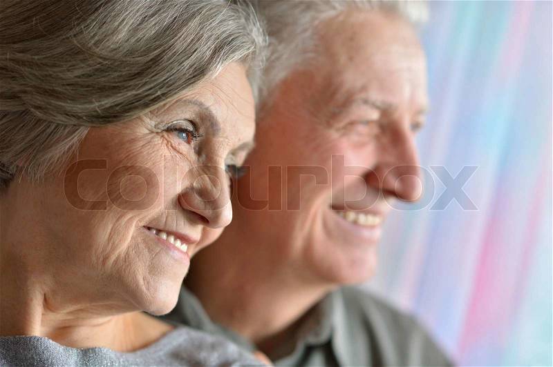 Portrait of happy older pair, stock photo