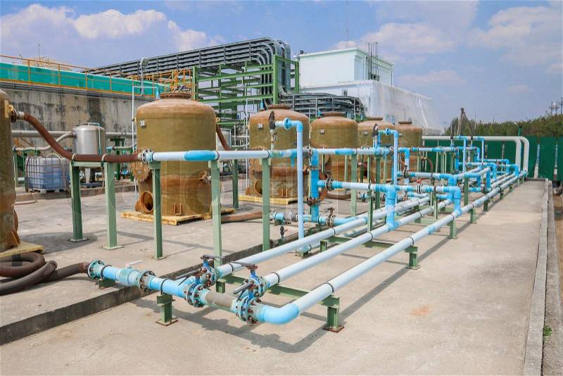Chemical tank storage with PVC pipe line in factory, stock photo