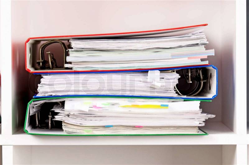 Close-up of file folders on the shelves at office, stock photo
