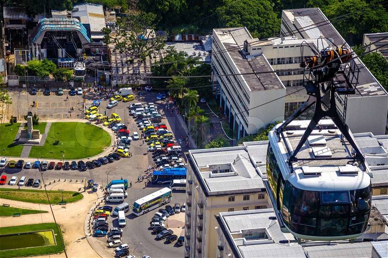 Overhead cable car moving over a city, Rio De Janeiro, Brazil, stock photo