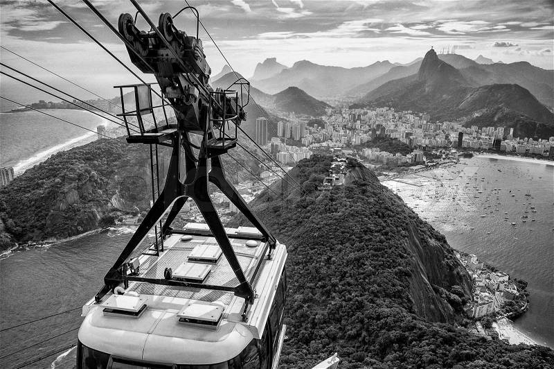 Overhead cable car approaching Sugarloaf Mountain, Rio De Janeiro, Brazil, stock photo