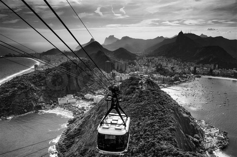 Overhead cable car approaching Sugarloaf Mountain, Rio De Janeiro, Brazil, stock photo