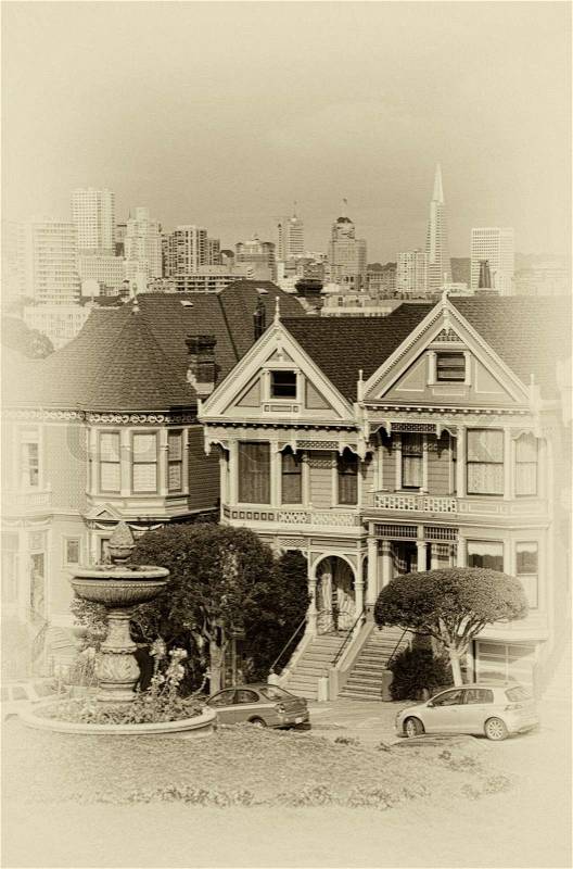 Victorian style houses on the Steiner Street with skylines in the background, Alamo Square Park, Alamo Square, San Francisco, California, USA, stock photo