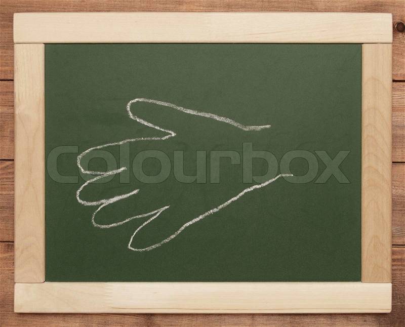 Hand print on blackboard, stock photo