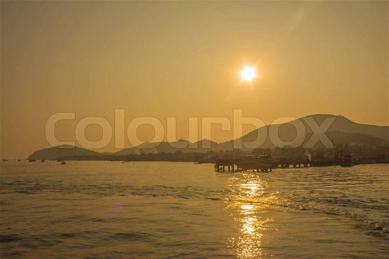 The sun sets on the island, stock photo