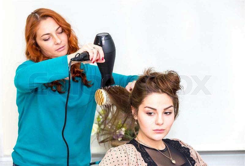 No titlewoman in a beauty salon doing hair, stock photo