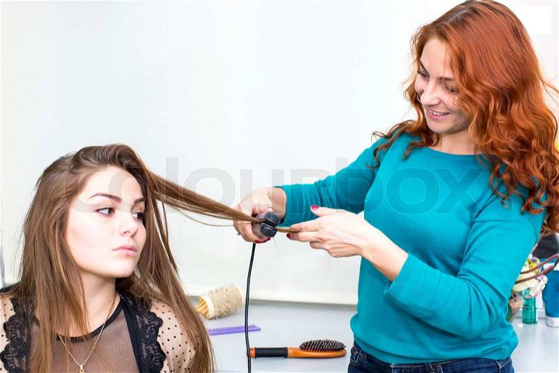 No titlewoman in a beauty salon doing hair, stock photo
