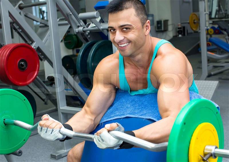Young man training in the gym, stock photo