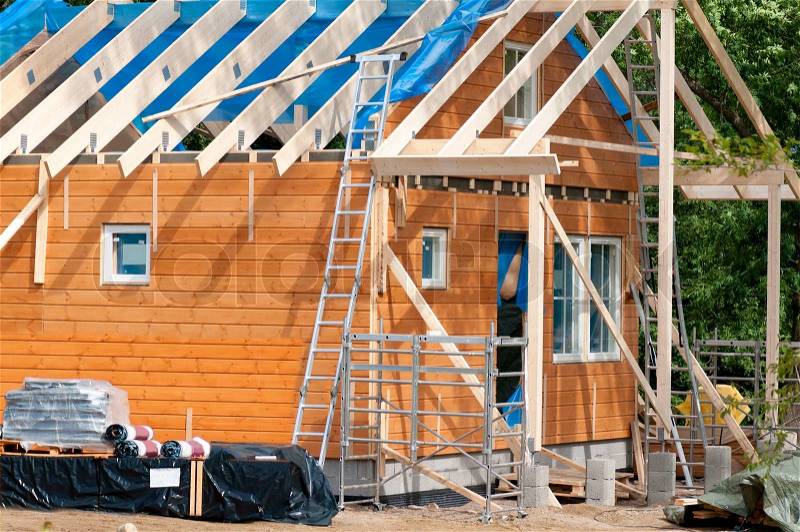 Construction of a wooden house, stock photo
