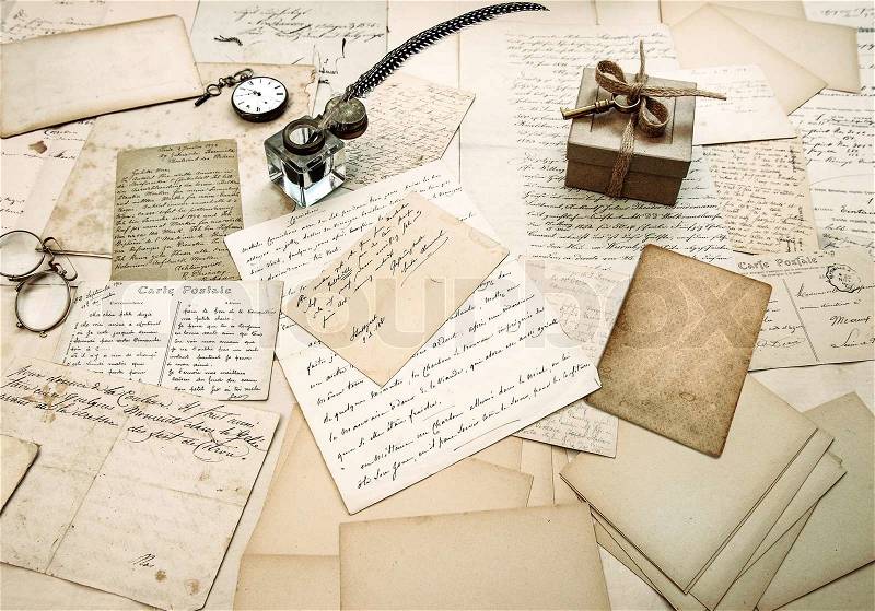 Old letters, vintage postcards and antique feather pen. nostalgic sentimental background, stock photo