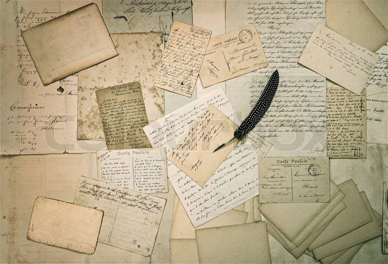 Ephemera. old letters, handwritings, vintage postcards and antique feather pen. nostalgic sentimental textured background, stock photo