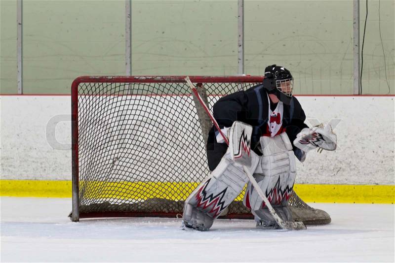Ice hockey goalie ready to make a save, stock photo