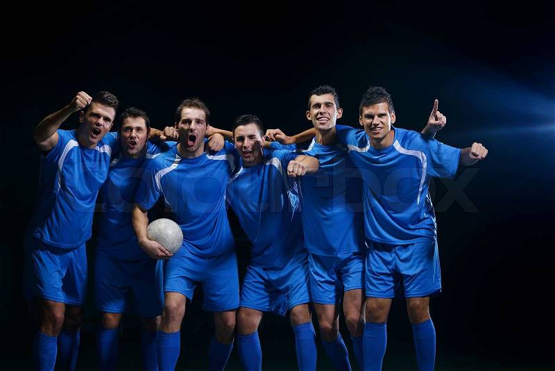 Soccer players team group celebrating the victory and become champion of game while holding win coup, stock photo