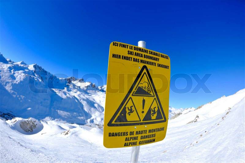 Sign board at High mountains under fresh snow in the winter season, stock photo