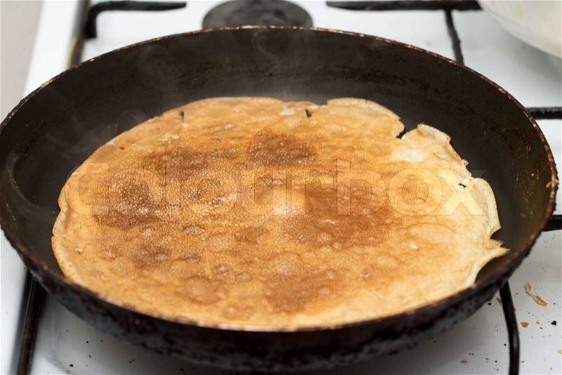 Pancakes fried in a pan, stock photo