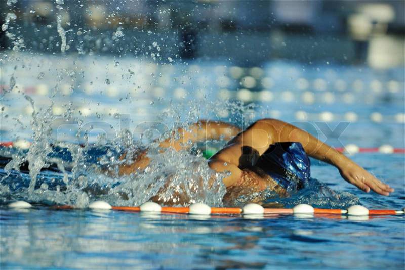 Health and fitness lifestyle concept with young athlete swimmer recreating on olimpic pool, stock photo