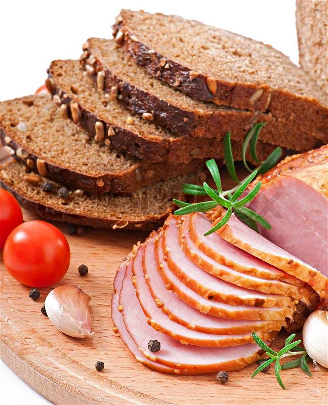 Ham, bread and spices on wooden board, stock photo