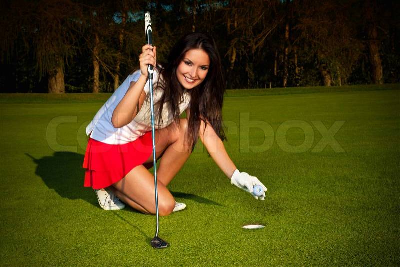 Golf girl at green, stock photo