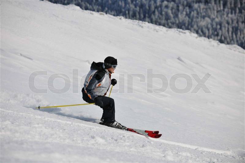 Skier free ride downhill at winter season on beautiful sunny day , stock photo