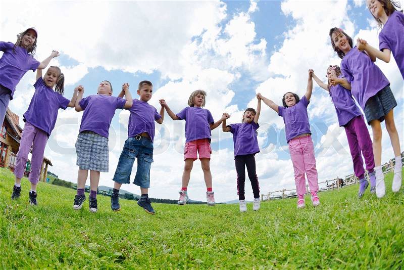 Happy kids group have fun in nature outdoors park, stock photo