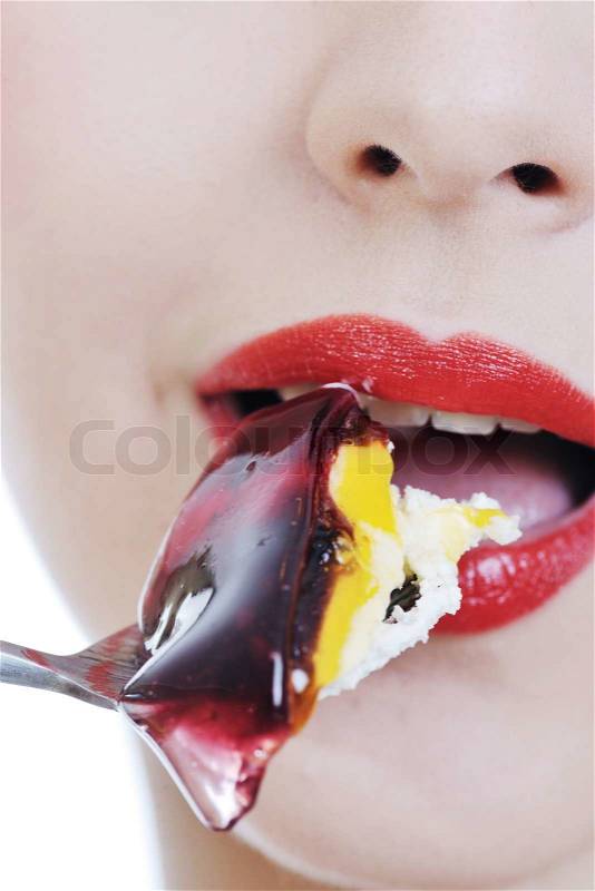 Beautiful young retro pinup woman eat sweet cake food isolated on white iin studio, representing diet and healthy concept, stock photo