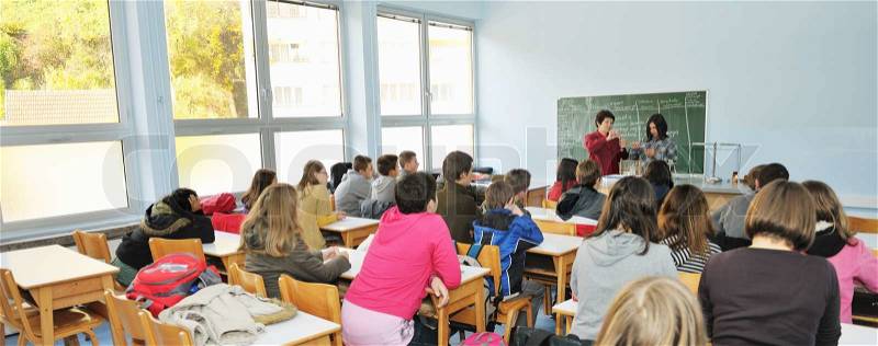 Science and chemistry classees at school with smart children and teacher , stock photo
