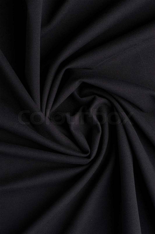 Spiral folds on black cloth. High resolution texture, stock photo