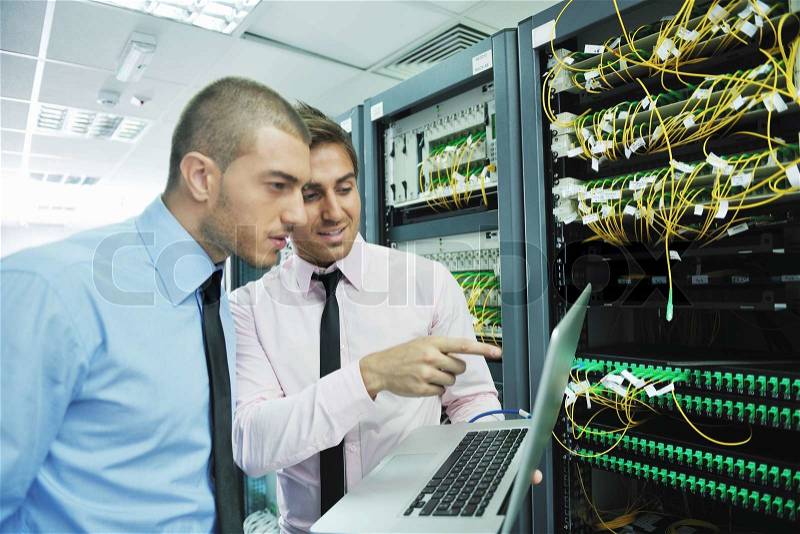 Group of young business people it engineer in network server room solving problems and give help and support, stock photo